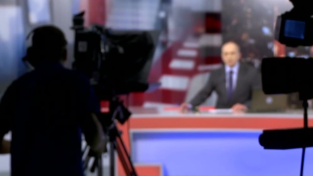 Backstage shooting news in a television studio. News presenter.