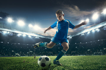 Young boy with soccer ball doing flying kick at stadium. football soccer players in motion on green grass background. Fit jumping boy in action, jump, movement at game. Collage - obrazy, fototapety, plakaty