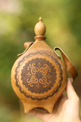 antique lether flask with pattern engraving and belt