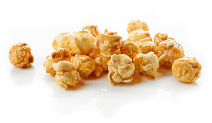 caramel popcorn on white background - obrazy, fototapety, plakaty