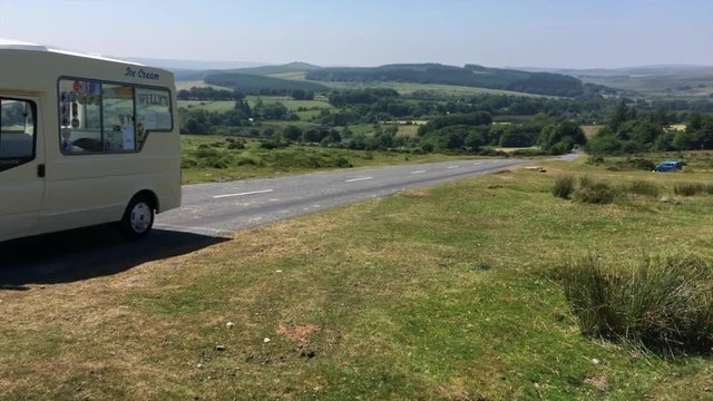 Ice cream van on the empty road in Dartmoor National Park, UK