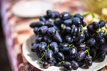 Black grape on a plate
