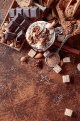 Cocoa with cream, cinnamon, chocolate pieces and various spices.