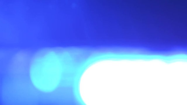 Defocused police red blue emergency lights flashing in the dark