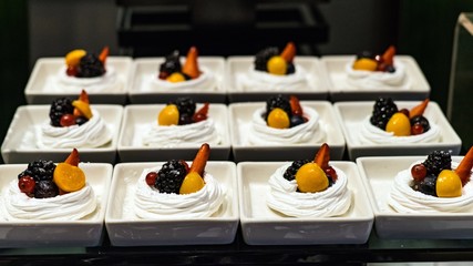 Delicious dessert in portions with fresh berries. Maldives.