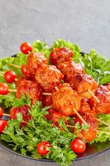 meatballs on skewers with fresh tomatoes