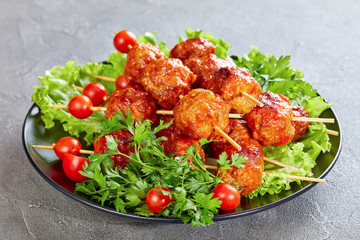 meatballs on skewers with fresh tomatoes