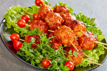 close-up of Roasted meatballs on skewers