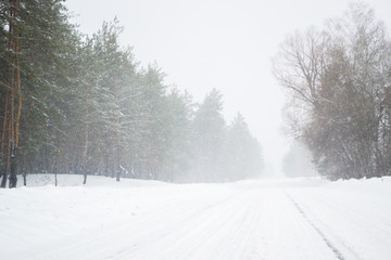 frosty and snow season winter on the road in the country