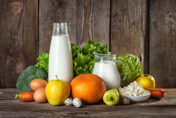 Set of different foods on the old wooden background