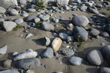 Sandy beach with large boulders