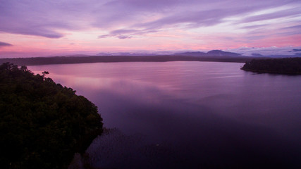 Fototapeta na wymiar mahinapua golden hours purple reflections