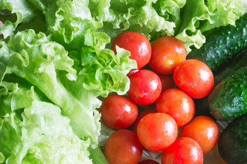 The concept of healthy eating. Background with vegetables. Green salad and tomatoes