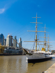 Fototapeta na wymiar Vertical pic of Puerto Madero with old ship in Buenos Aires Argentina