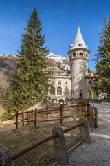 Savoia Castle and snow covered peak in Gressoney