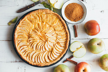 Homemade apple pie tart on white wooden background