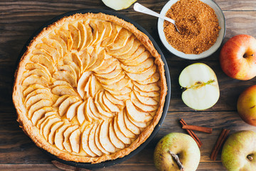 Homemade apple pie tart on rustic wooden background
