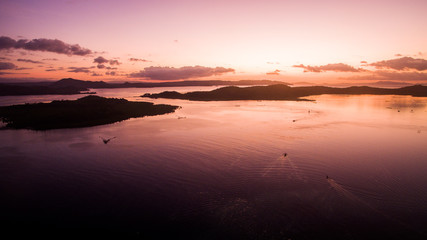 Obraz premium siargao islands sunset purple sea ships