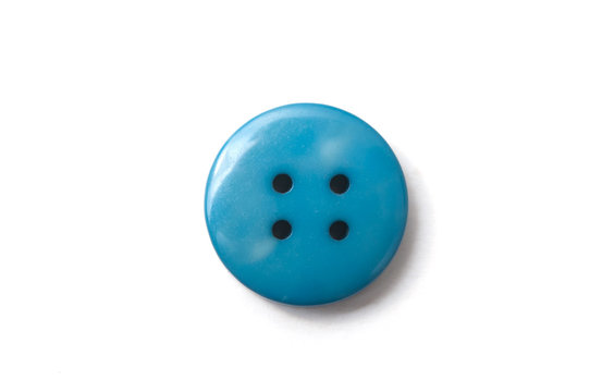 closeup of blue sewing buttons on white background