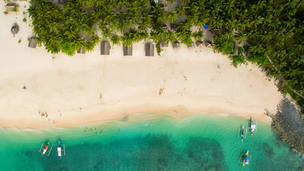 Fototapeta na wymiar abonded island in pacific ocean palm trees aerial view drone vertical canoes in pacific ocean palm trees aerial view drone vertical canoes beach