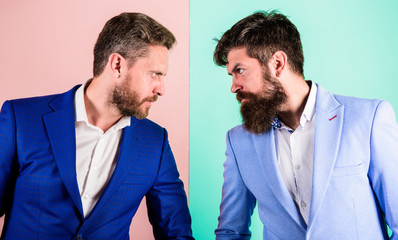 Business competition and confrontation. Businessmen stylish appearance jacket pink blue background....