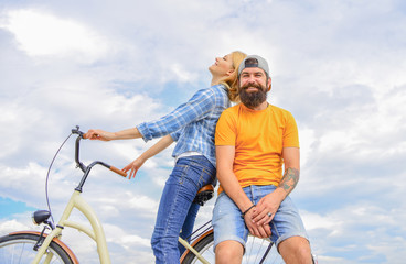 Couple in love date outdoors cycling. Bike rental or bike hire for short periods of time. Date ideas. Couple with bicycle romantic date sky background. Man and woman spend active leisure with bike