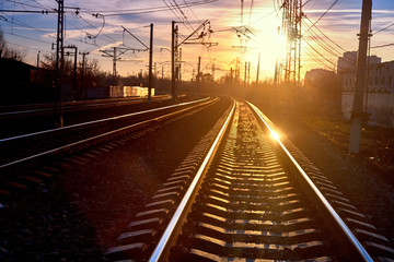 Fototapeta na wymiar Railroad in motion at sunset.