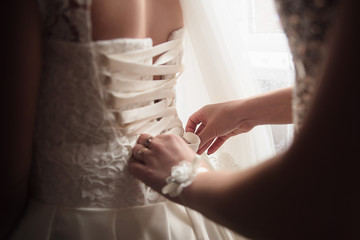 Lace-up wedding dress. White dress of the bride.