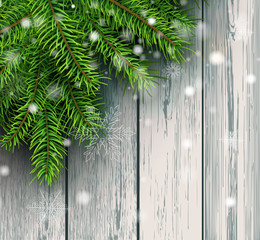 Christmas background, green fir tree decoration on old wooden board with snowflakes