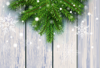 Christmas background, green fir tree decoration on old wooden board with snowflakes