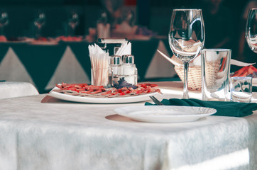 Serving of table, salads and glasses