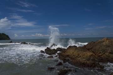 waves crashing on the rocks Sea waves hit beach rocks. Never stop all the time