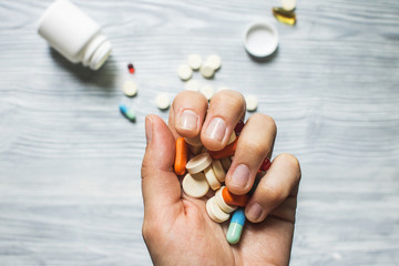 Colorful pills and medicines in the hand