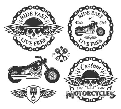 Skull custom motorcycles shop Badges or Labels set With wings, chain, piston, shield and bike.
