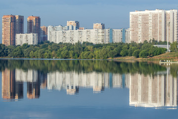 Fototapeta na wymiar morning city reflected in the river