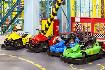 Children's attraction with colorful electric cars.