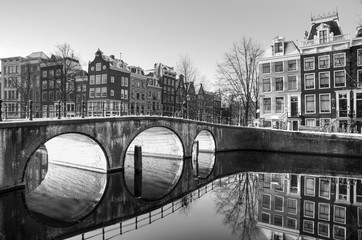 Beautiful sunrise view of the famous UNESCO world heritage canals of Amsterdam, the Netherlands, in black and white. Keizersgracht (Emperors canal)   © dennisvdwater