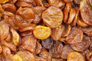 Dried apricots texture in shop close up.