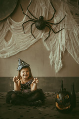 girl in the witch costume frightens.