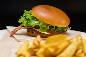 Bacon cheeseburger with French fries