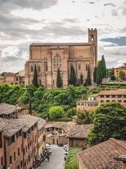 Panorama of the city of Siena in Tuscany, photographed from a hill, here you can see the roofs of houses, ancient cathedrals