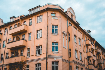 typical orange building in east berlin on a cloudy day