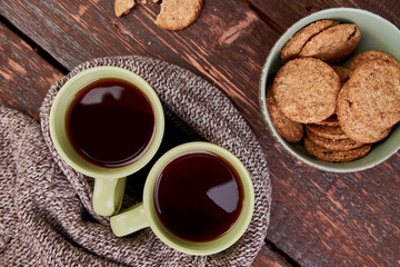 Two warm cups of tea, autumn leaves