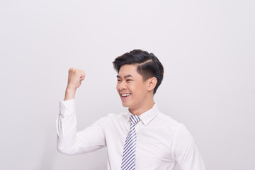 Portrait of happy excited young asian businessman
