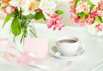 Beautiful bouquet of alstroemeria and cup tea