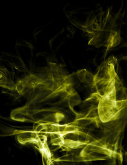Yellow smoke on black background