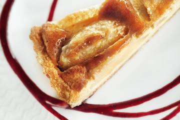 Close up of a pear tart on a plate