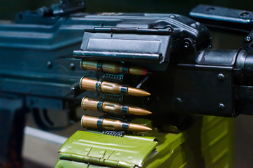Machine gun with ammunition.