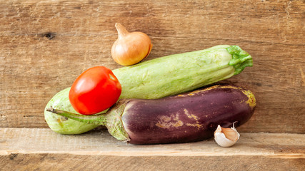 Fresh an colorful ratatouille vegetable on a wooden plank