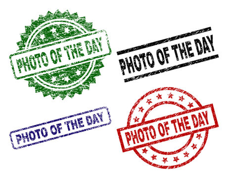 PHOTO OF THE DAY seal prints with distress texture. Black, green,red,blue vector rubber prints of PHOTO OF THE DAY caption with dust texture. Rubber seals with circle, rectangle, medal shapes.
